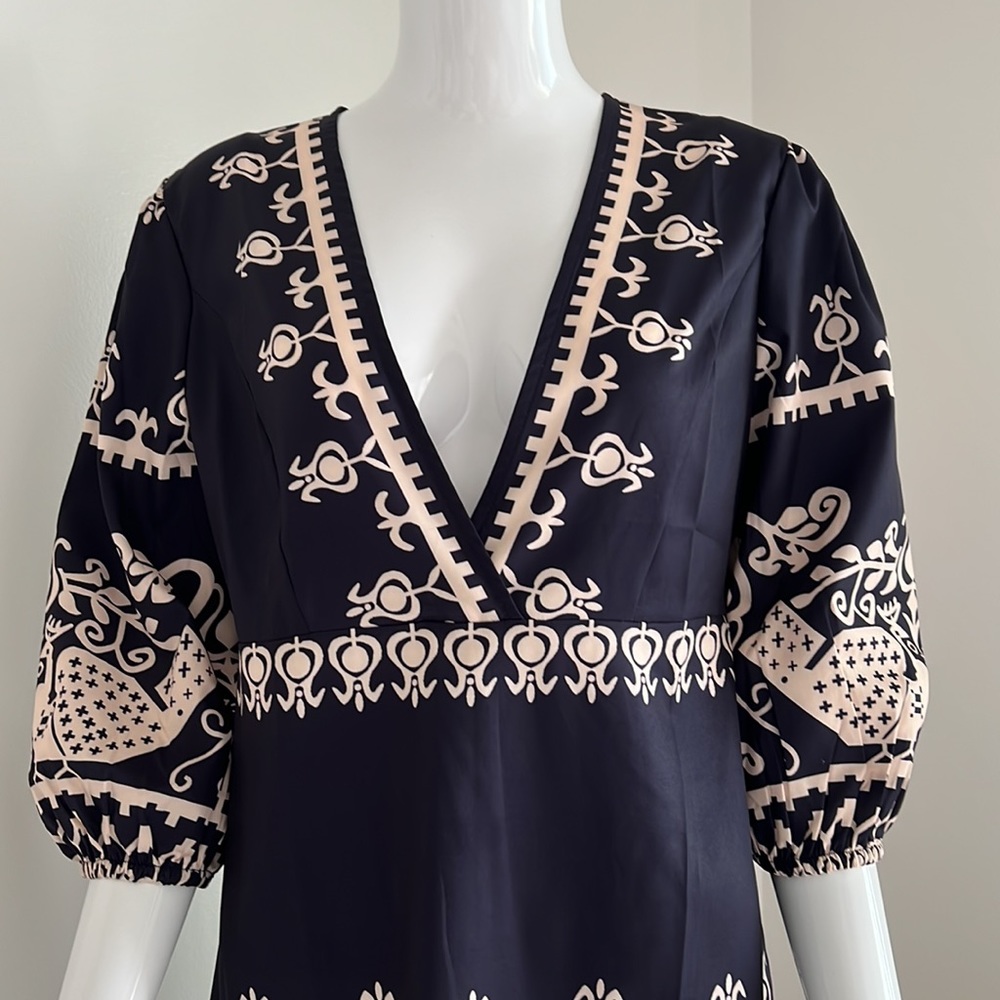 Silk dress side zipper don’t know brand or material but I believe it’s silk